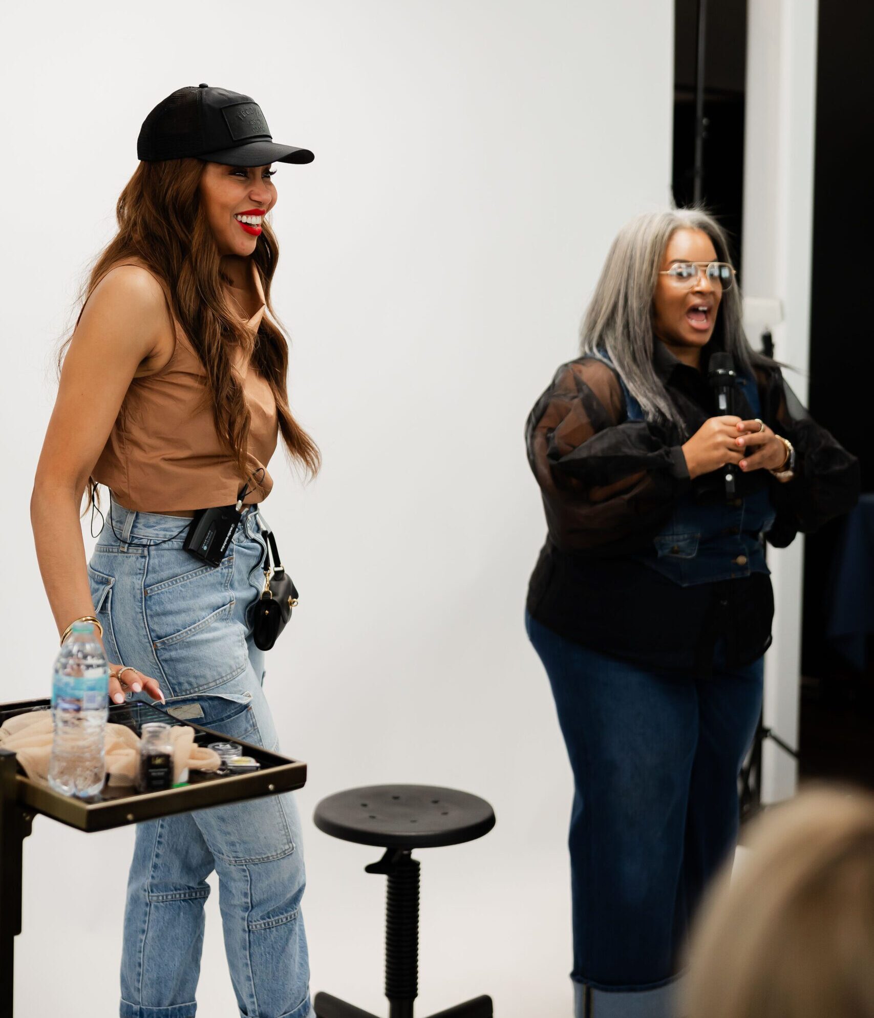 Candice Motley and Amber Robinson teach a group of stylists